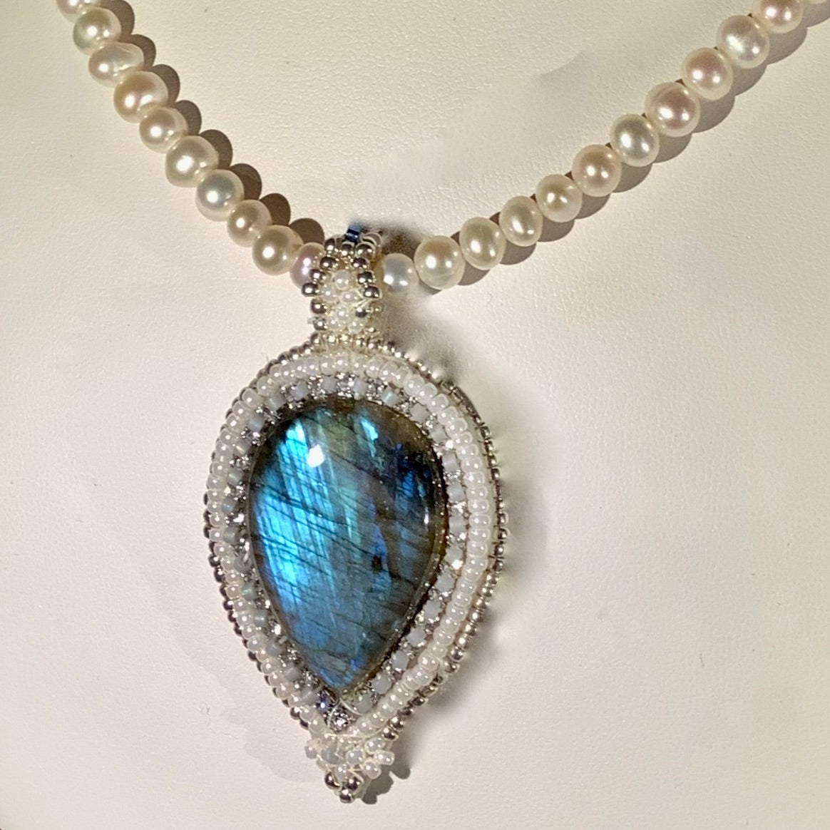 Labradorite pendant with Swarovski crystals on a pearl necklace